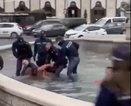 Immigrant bathes in Rome's historic fountain